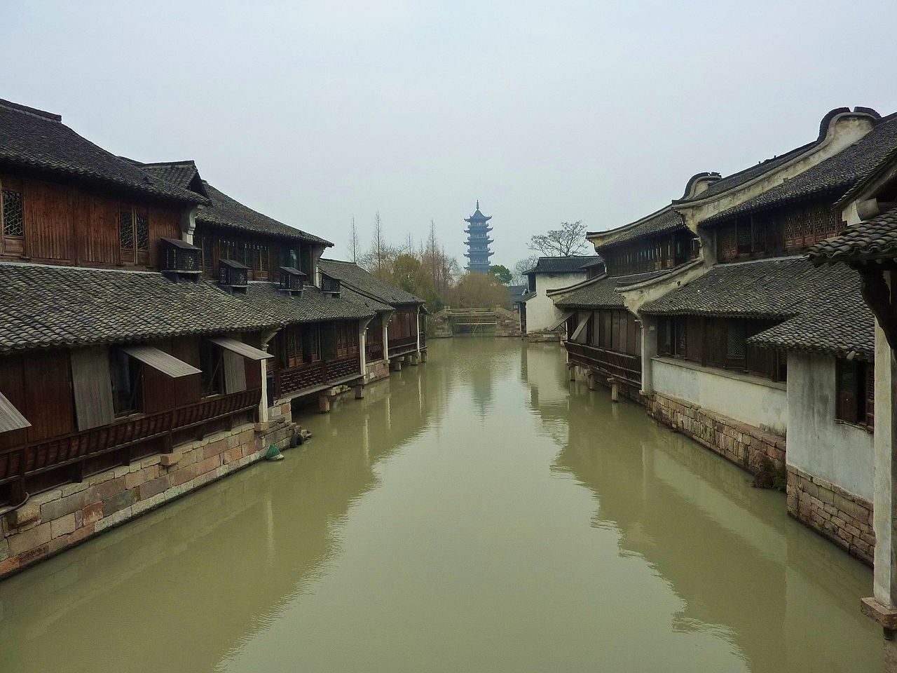 A sculled boat working the West Zone canals at dusk